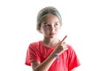 Serious little girl pointing to blank copy space Royalty Free Stock Photo