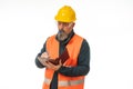 Serious-looking caucasian construction manager making notes on white background