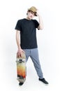 Serious looking teenager sitting on skate Royalty Free Stock Photo