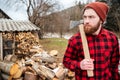 Serious lumberjack holding axe