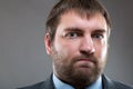 Serious male bearded face close up portrait