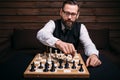 Serious male chess player makes victory move Royalty Free Stock Photo