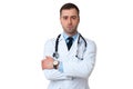 Serious male doctor crossed arms with stethoscope on white Royalty Free Stock Photo