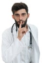 Serious male doctor instruct to keep silence Royalty Free Stock Photo