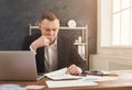 Serious man office worker is reading report Royalty Free Stock Photo