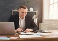 Serious man office worker is reading report Royalty Free Stock Photo