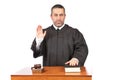 Serious male judge taking oath Royalty Free Stock Photo