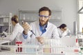 Serious male scientist is working on analysis of samples while working in laboratory. Royalty Free Stock Photo