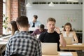 Freelancer talking over phone in coworking space Royalty Free Stock Photo