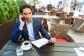 Serious man deals with business by telephone Royalty Free Stock Photo