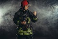 Serious man extinguish fire Royalty Free Stock Photo