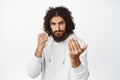 Serious man fighter, luring to come closer, clench fist to attack, boxing with someone, flick fingers for person to Royalty Free Stock Photo