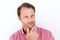 Serious man with hand to chin Royalty Free Stock Photo