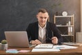 Serious man office worker is reading report Royalty Free Stock Photo