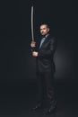 serious man in suit with japanese katana sword Royalty Free Stock Photo