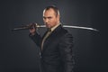 serious man in suit with katana sword Royalty Free Stock Photo