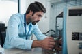 Serious man, it or technician fixing computer, PC or processor in engineering service workshop. Worker, CPU or hardware Royalty Free Stock Photo