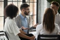 Serious man wearing glasses sharing problems at group therapy session Royalty Free Stock Photo