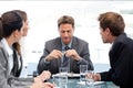 Serious manager with his team during a meeting Royalty Free Stock Photo