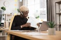 Serious marketing african man in suit and headset talking to client on video call Royalty Free Stock Photo