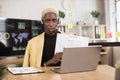 Serious marketing african man in suit and headset talking to client on video call Royalty Free Stock Photo