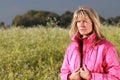 Serious mature woman relaxing in nature Royalty Free Stock Photo