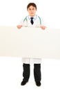 Serious medical doctor holding blank billboard Royalty Free Stock Photo