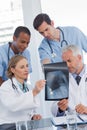 Serious medical team examining radiography Royalty Free Stock Photo