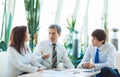 A serious meeting of business men at the office. Discussion and Royalty Free Stock Photo