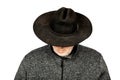 Serious Middle-Aged Caucasian Man in Dirty Black Cowboy Hat Looking Down on White Background Royalty Free Stock Photo