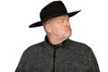 Serious Middle-Aged Caucasian Man in Worn Cowboy Hat looking to the Side - Isolated Portrait on White Background Royalty Free Stock Photo