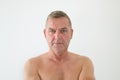 Serious middle-aged man posing shirtless Royalty Free Stock Photo