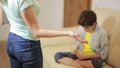 Serious mother lecturing unpleased teenager in home