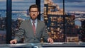 Serious newsreader speaking newscast evening studio closeup. Man broadcasting Royalty Free Stock Photo