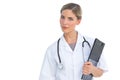 Serious nurse holding clipboard Royalty Free Stock Photo