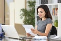 Serious office worker reading a paper letter