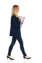 Serious Office Worker Is Walking With Clipboard
