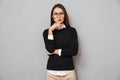 Serious pensive asian woman in business clothes and eyeglasses