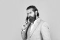 serious phone call. communication concept. brutal handsome man with moustache speak on phone. call and conversation Royalty Free Stock Photo