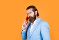 serious phone call. communication concept. brutal handsome man with moustache speak on phone. call and conversation Royalty Free Stock Photo