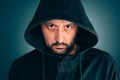 Serious portrait of adult man with hoodie