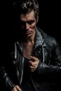 Serious portrait of a young man in leather jacket