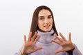 Serious pretty woman making stop hand sign palm gesture, Stay away and do not touch me concept Royalty Free Stock Photo