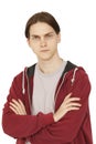 Serious puzzled young man with crossed arms portrait. Doubt, choice and think concept