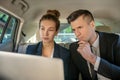 Serious man and woman business partners looking at laptop Royalty Free Stock Photo