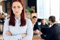 Serious red-haired woman in blue shirt. Royalty Free Stock Photo