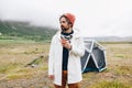 Serious rough outdoor man next to tent in iceland Royalty Free Stock Photo