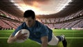Serious rugby player scoring a try