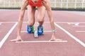 Serious runner standing at starting line Royalty Free Stock Photo