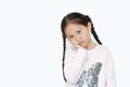 Serious and sad Asian little child girl with posture her hand on cheek with looking at camera isolated on white background